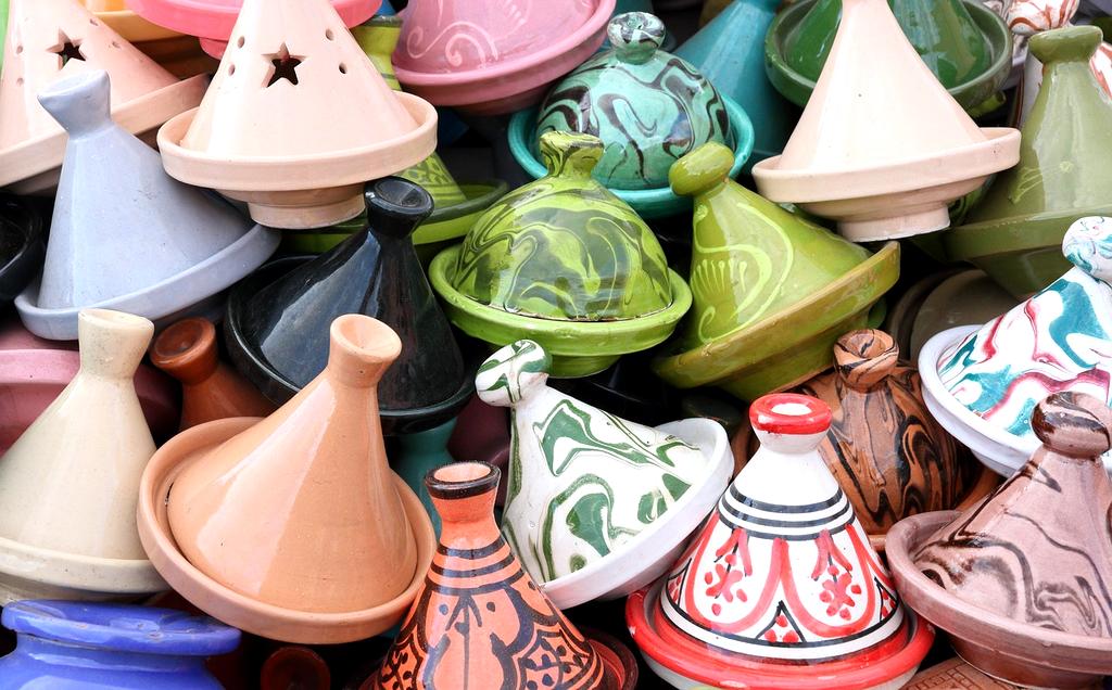 Vibrant Moroccan marketplace with traditional lanterns and spices