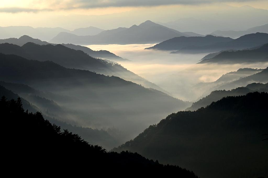 Breathtaking mountain landscape with winding paths symbolizing travel adventure